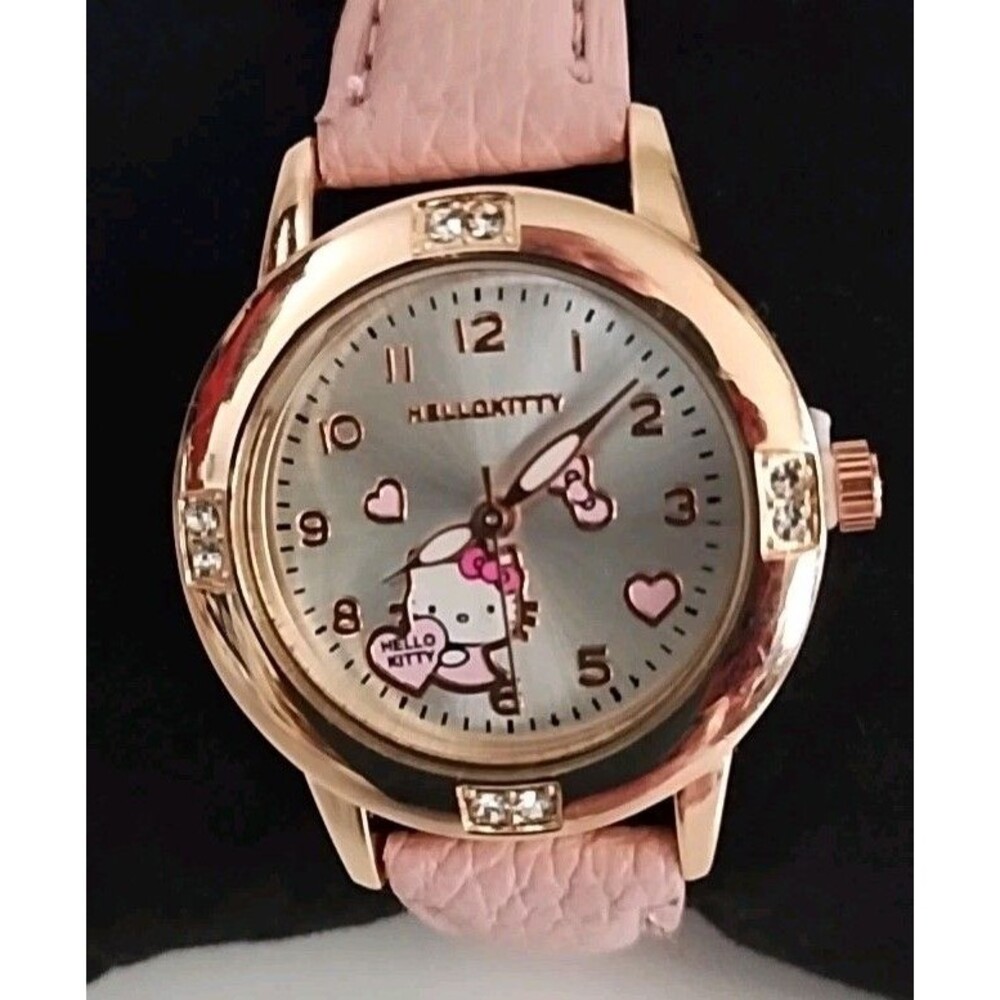 Sanrio Hello Kitty watch features a rose gold-tone case decorated with crystals